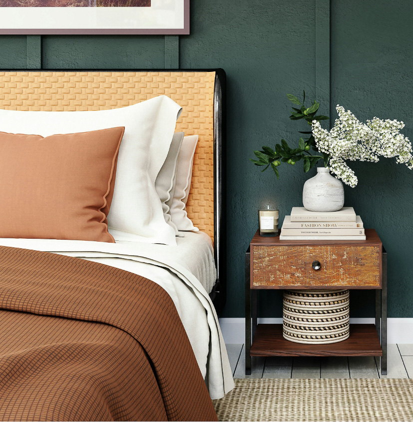Chambre à coucher chaleureuse avec tête de lit en osier et mur vert chez Marie Makos à Sciez